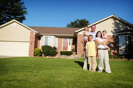 A family in front of a house