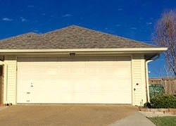 Action Garage Door technician Greg Beck installed and repaired this two car garage door on this residence in Garland Texas