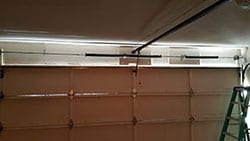 residential steel garage door spring repaired