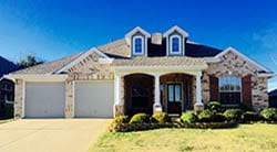 Action Garage Door installed and repaire these two single car steel garage doors on this home in Garland Texas by technician Adan Vega