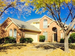 Action Garage Door highly trained technicians installed and repaired this two car steel garage door at this home in Trophy Club Tx