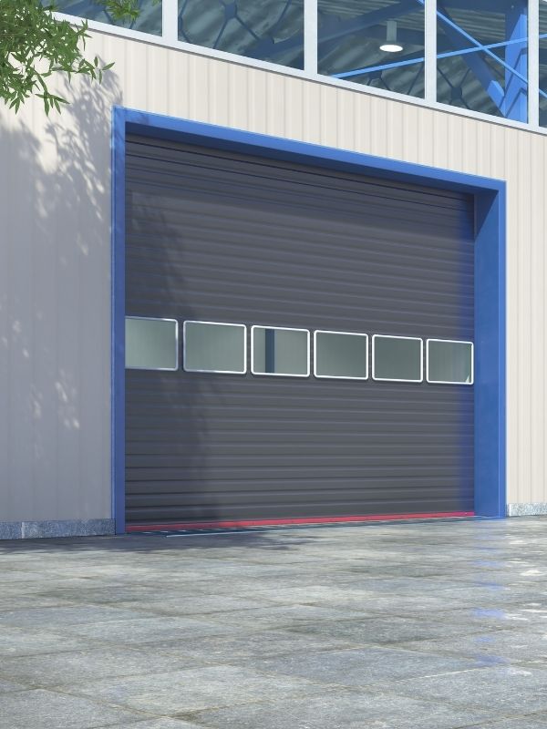 Rolling steel garage door on a commercial building.