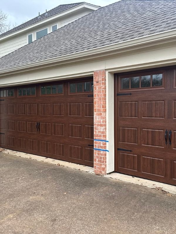 A pair of new garage doors was installed on a residential home. 