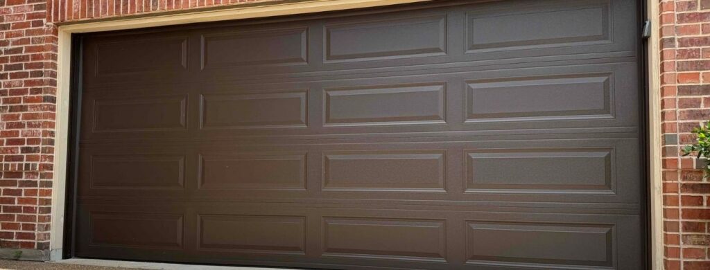 A steel garage door was installed on a beautiful residential home.